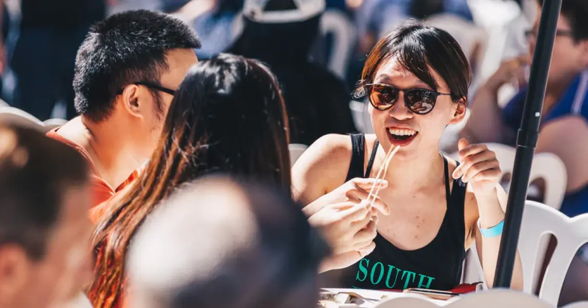 Taste of Calgary attendees sharing food outdoors