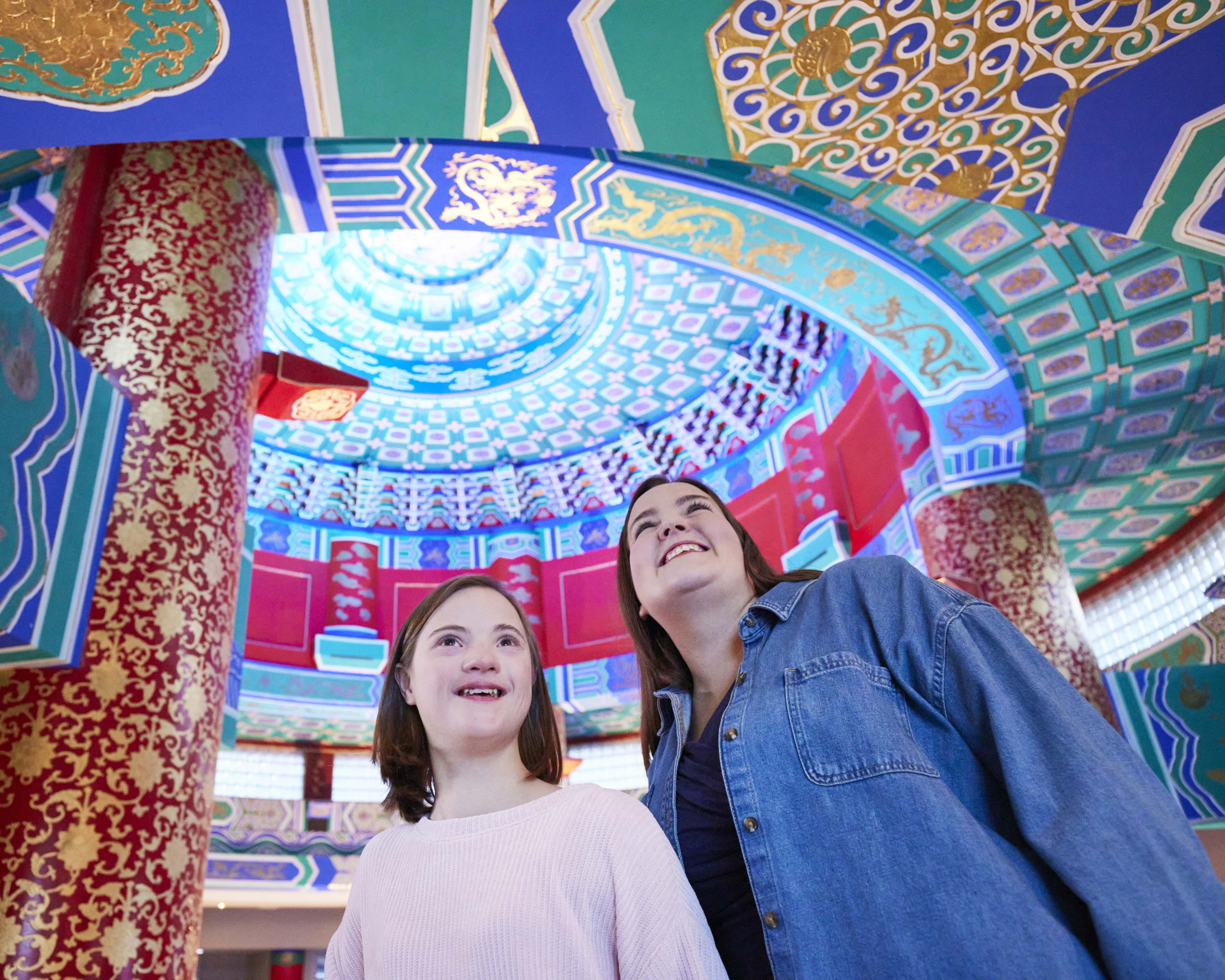 mother and daughter admire the ornate ceiling of the Calgary Chinese Cultural Centre