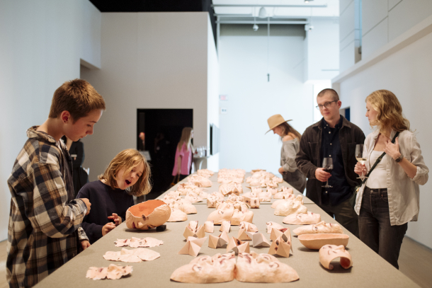Kids and adults enjoying an exhibit at the Esker Foundation