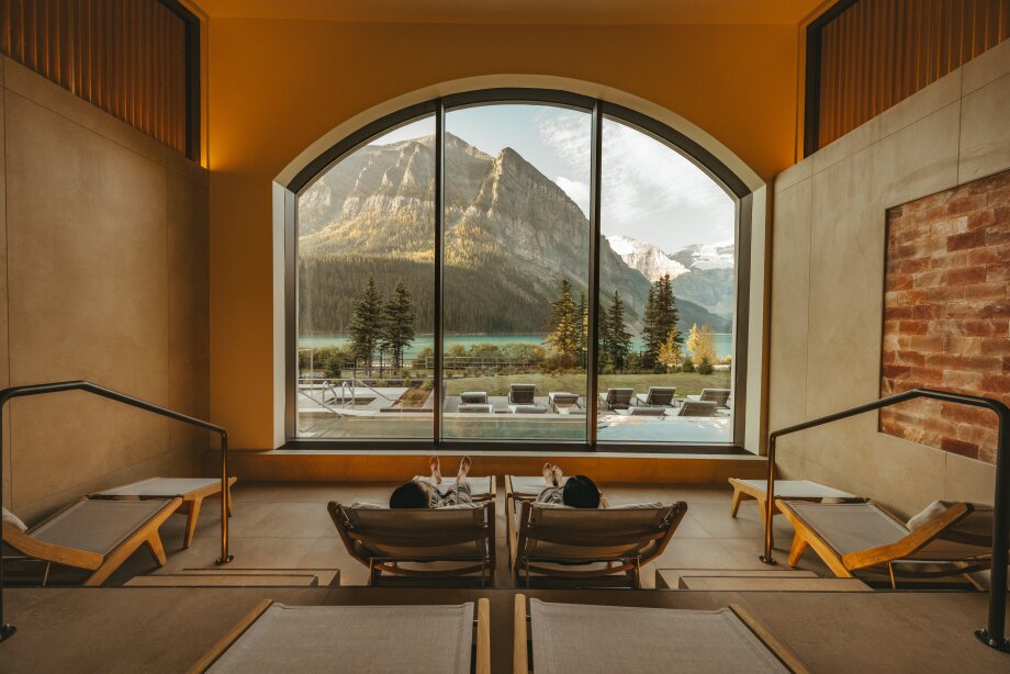 A couple relax as they are served wine at BASIN.