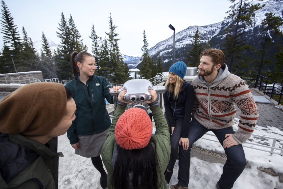 Park guide talking to visitors at the Upper Hot springs
