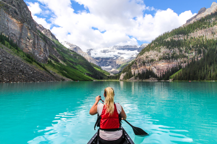 Scenic shot of women canoeing on Lake Louise