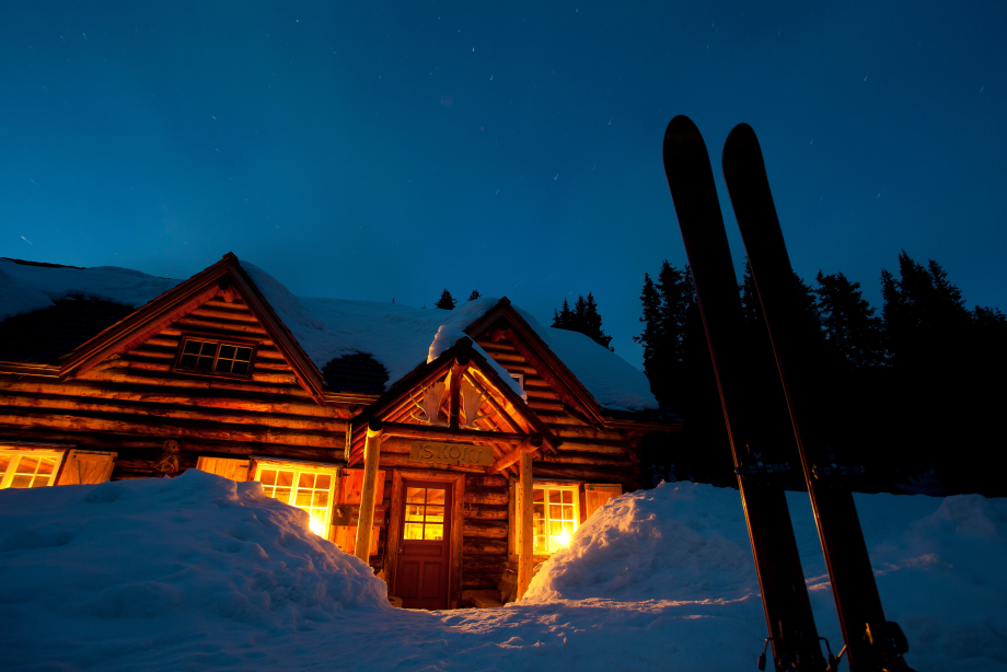 Skoki Lodge lit up in the evening, back country