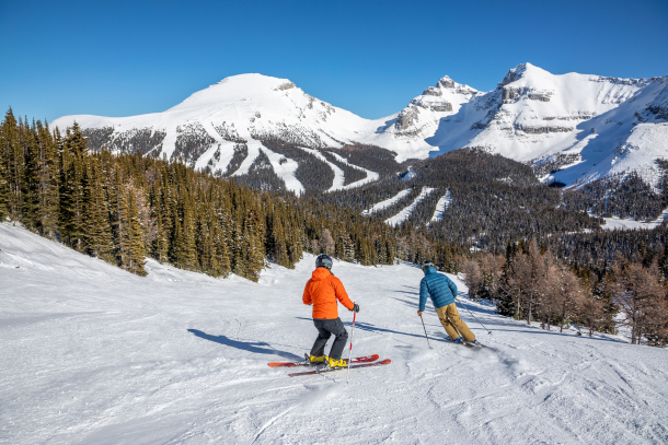skiing down an intermediate run at sunshine village