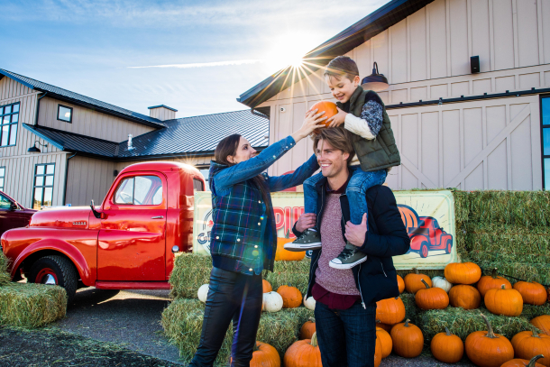 family pumpkin picking at Granary Road in autumn