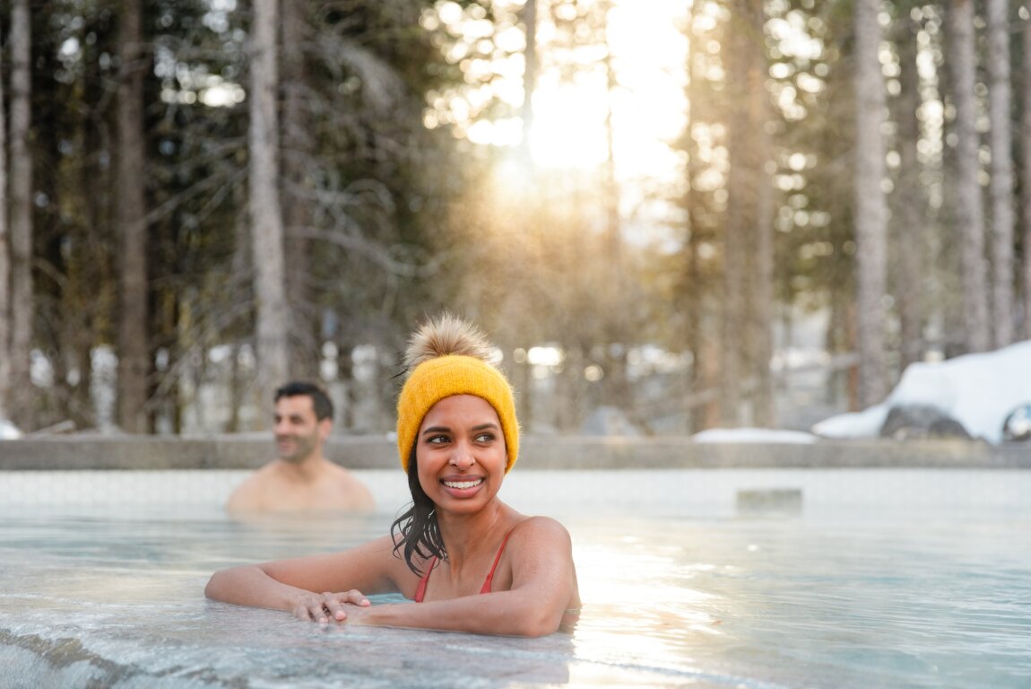 Couple enjoying the Nordic Spa in Pomeroy Kananaskis Mountain Lodge in Kananaskis Country