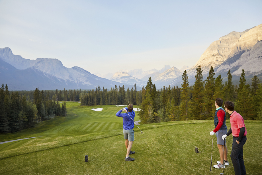 Golfers teeing off at Kananaskis Country Golf Course.