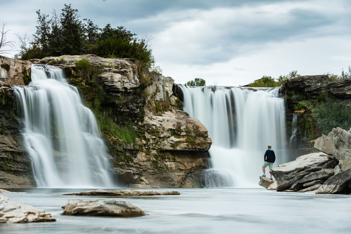 Person looking at Lundbreck Falls