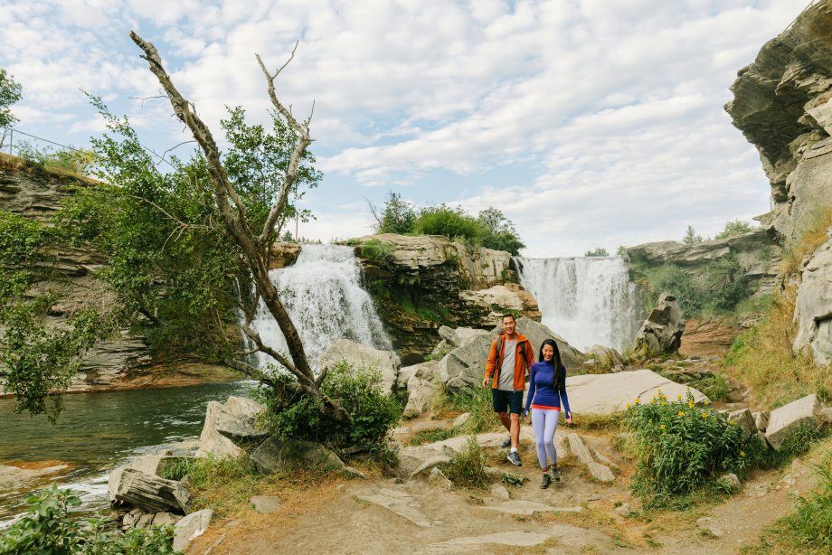 Couple exploring and enjoying Lundbreck Falls