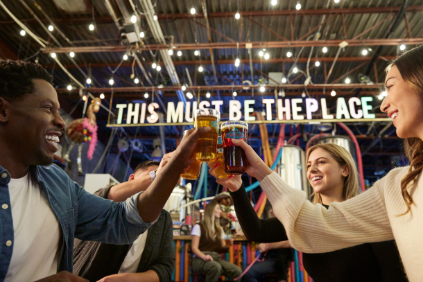 friends cheers pints of beer at Cold Garden