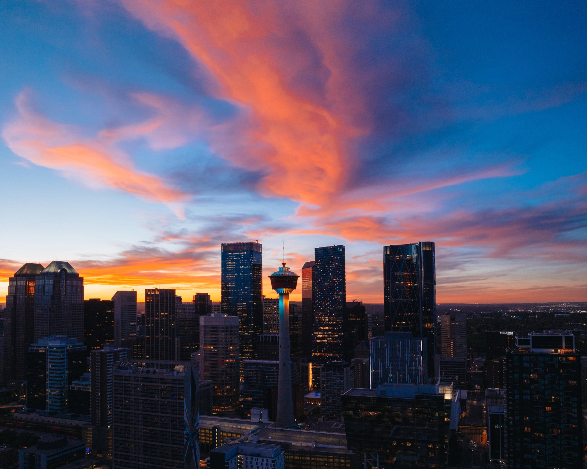 Skyline view of Calgary at sunset, from Scotman's Hill on a summer night.