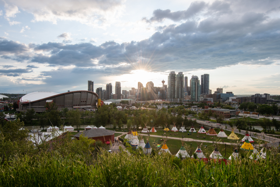 Elbow River Camp at Calgary Stampede against Calgary's downtown skyline backdrop