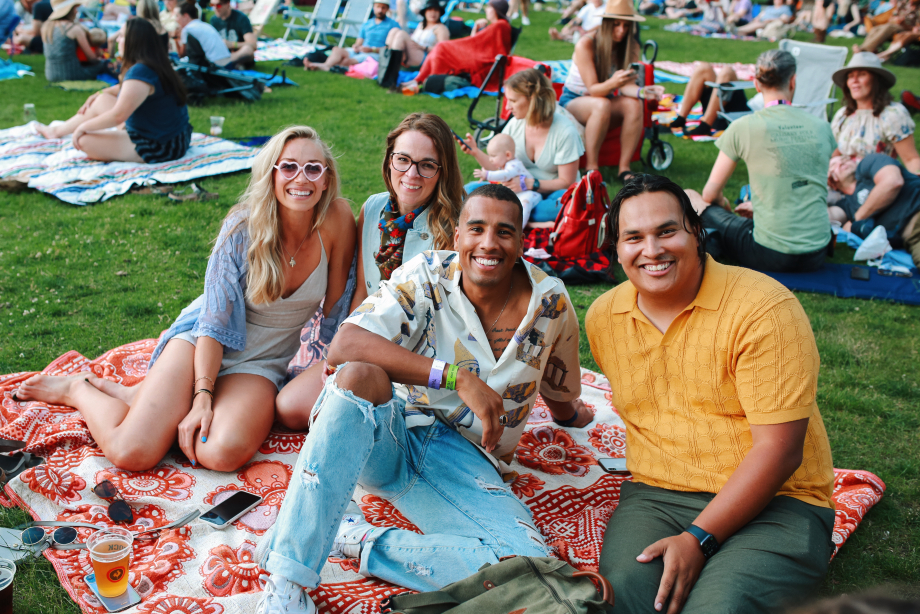 Group of friends having a picnic at the Calgary Folk Festival.