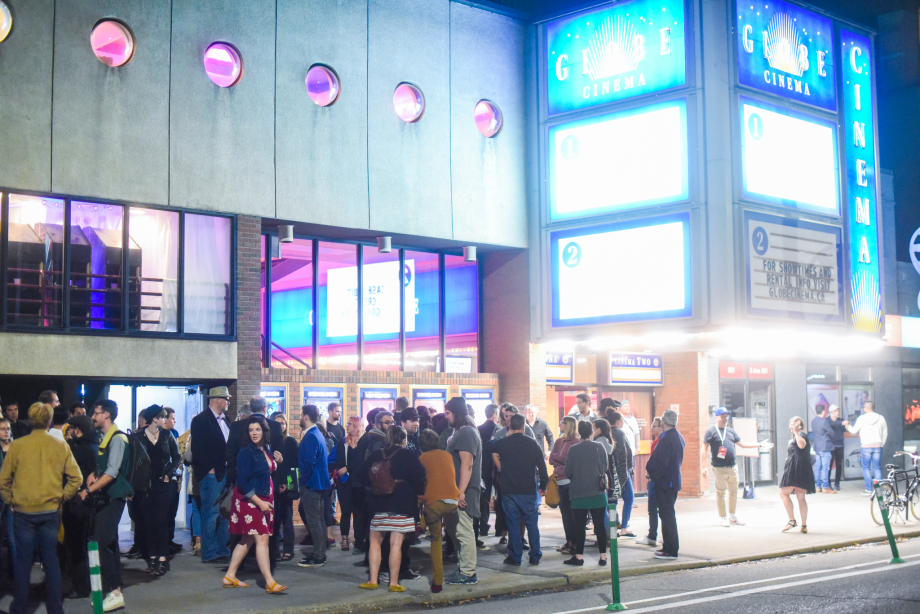 crowd of people outside the globe cinema