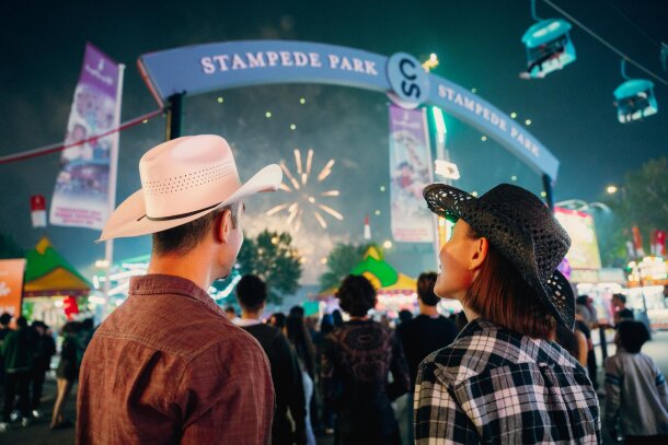 A couple watches the fireworks during the Calgary Stampede.