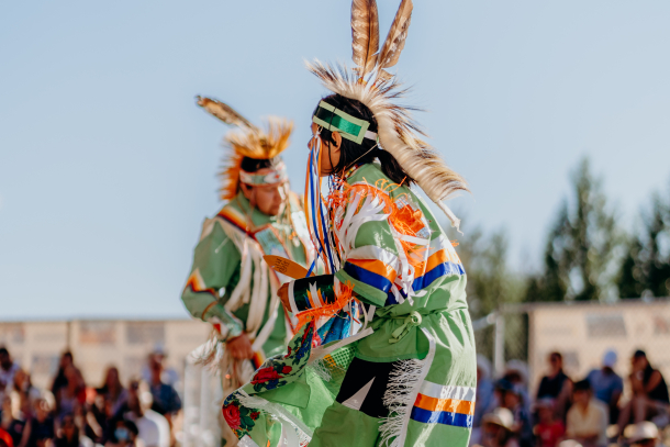 Indigenous dancers performing in traditional attire