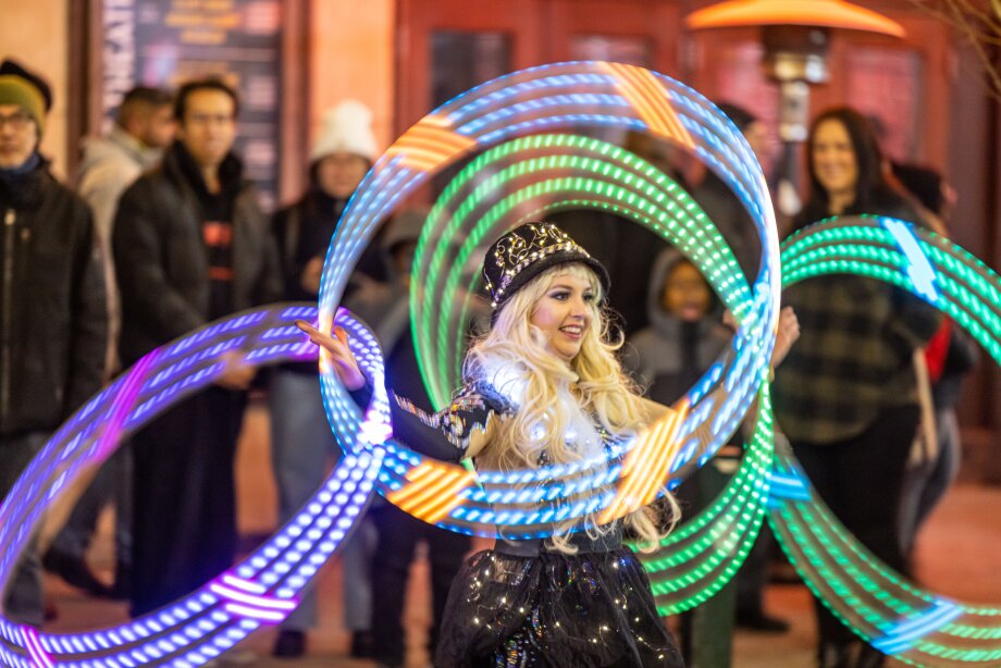 Woman performing with light up hoola hoops