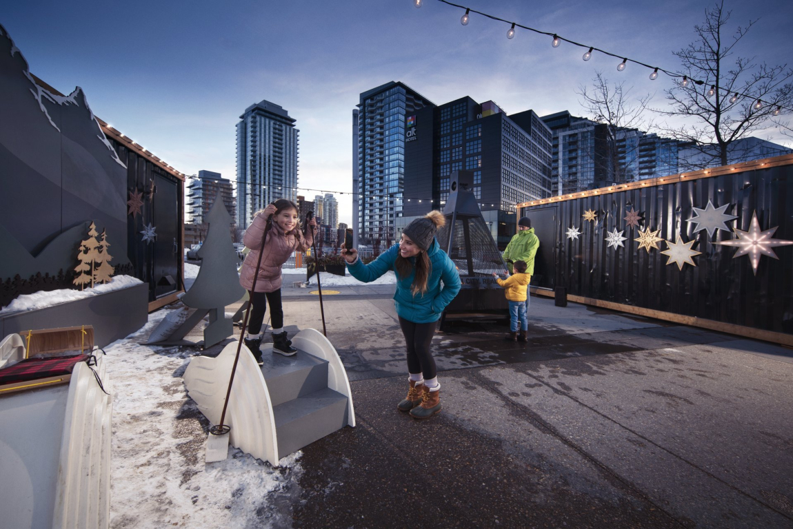Family exploring activation outside in the winter