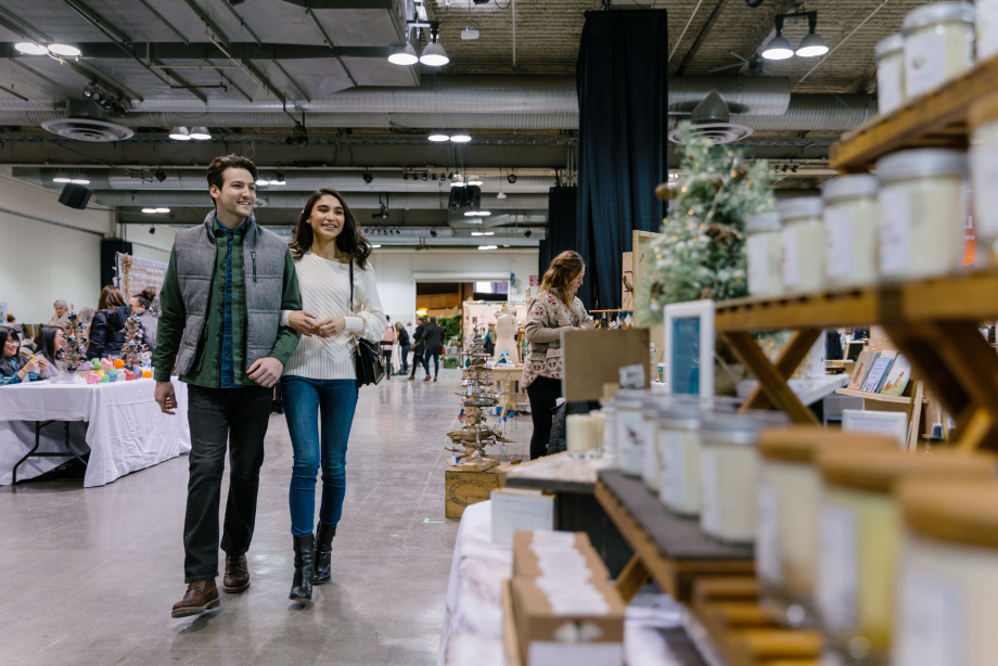 Couple walking through Christmas market