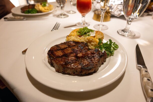 A plate of steak and potatoes at Caesar's Steakhouse.
