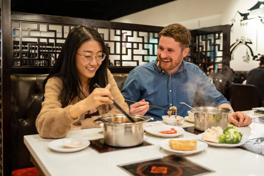 couple eating at Chine Hot Pot Noodles