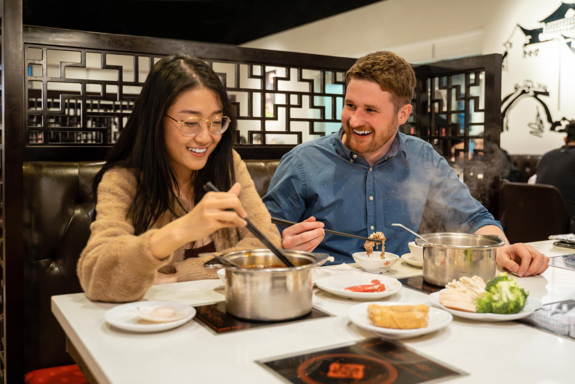 couple eating at Chine Hot Pot Noodles