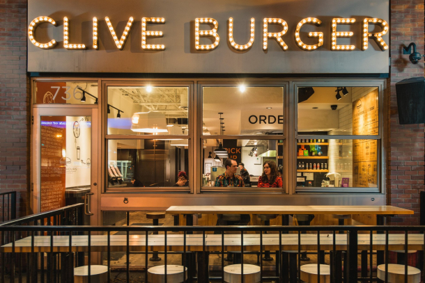 a couple dining at clive burger on 17th ave