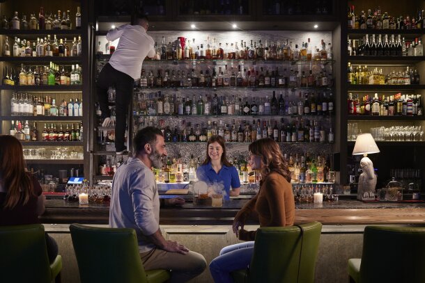 Couple grabbing a drink at Proof