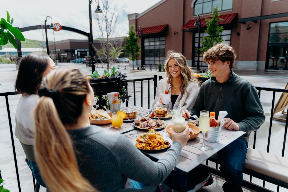 Group of friends eating brunch on a patio