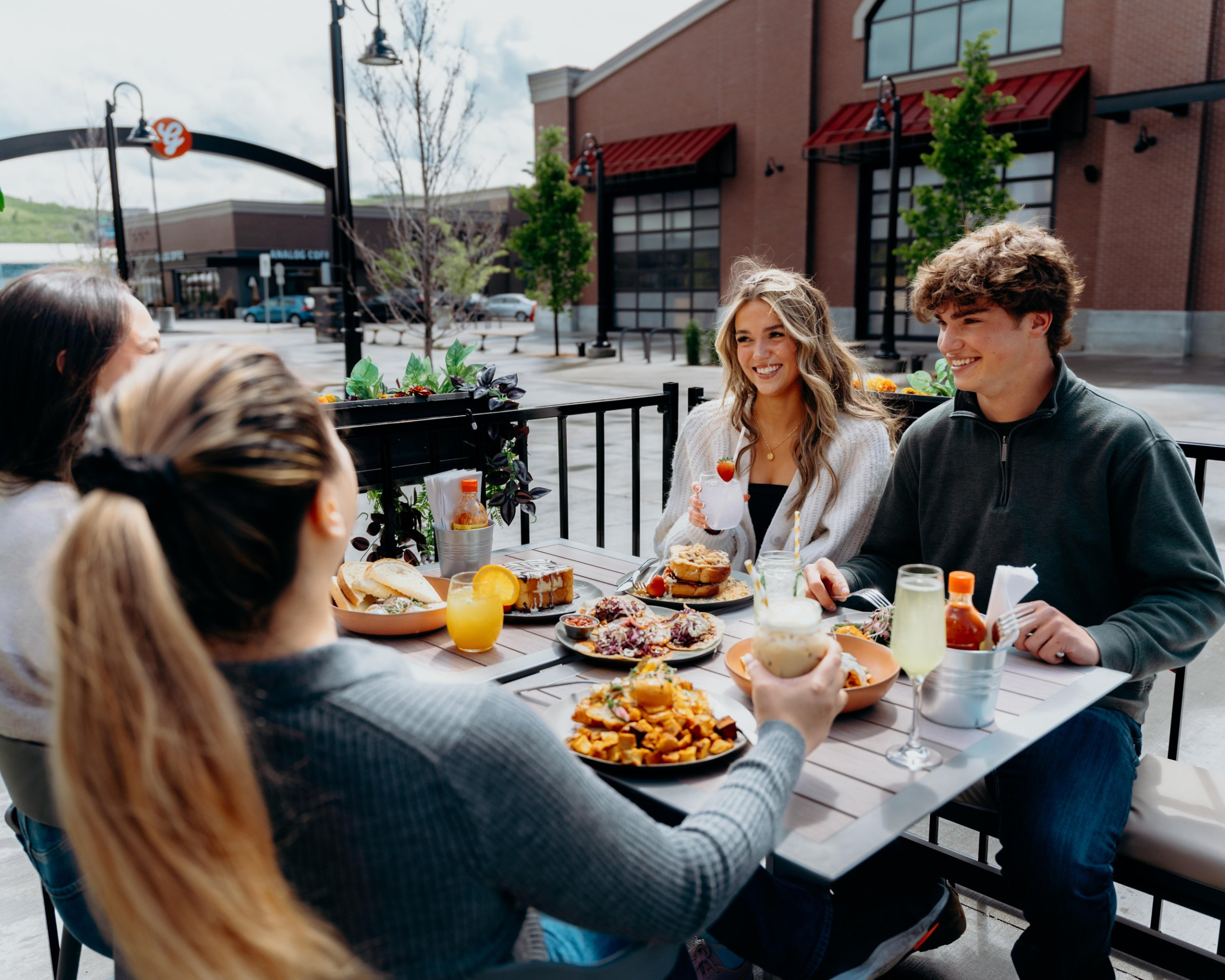 Group of friends eating brunch on a patio