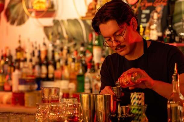 A bartender mixing a drink at Paper Lantern.