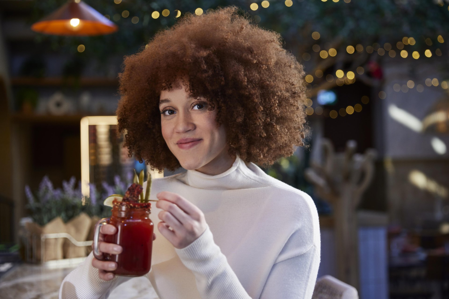 a woman enjoying caesar at Porch