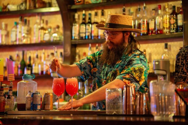 A bartender mixing drinks at Prosperity Bar.