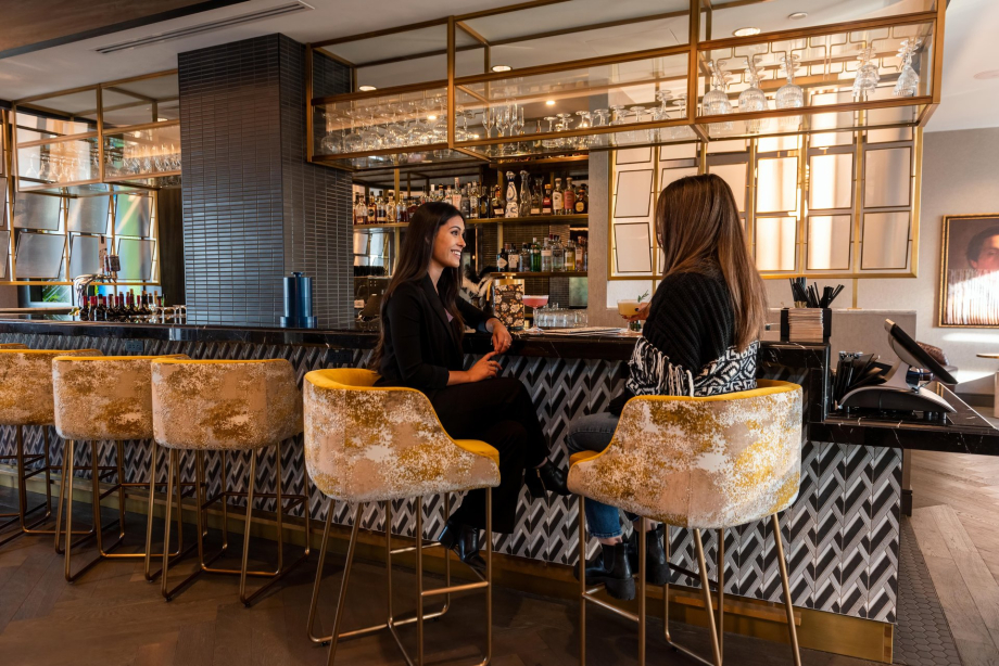 two ladies enjoying drinks at The Wilde on 27
