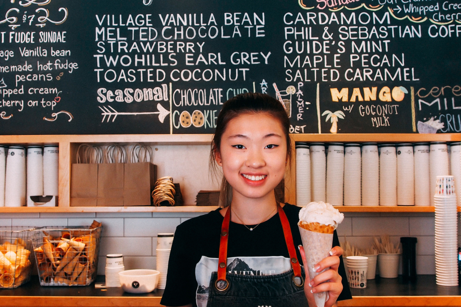 Server at Village Ice Cream holding an ice cream cone