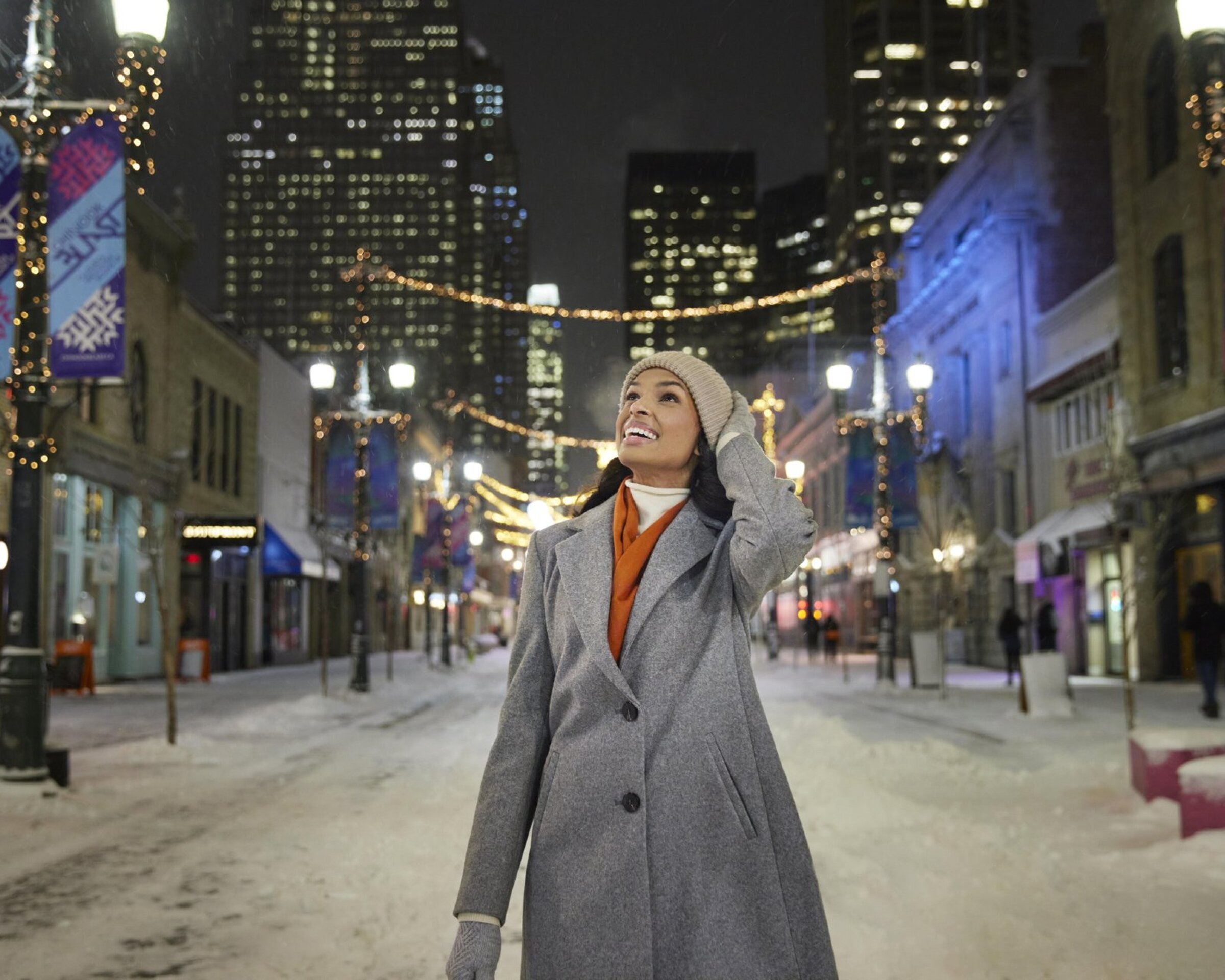 Woman walking down wintery Stephen Ave