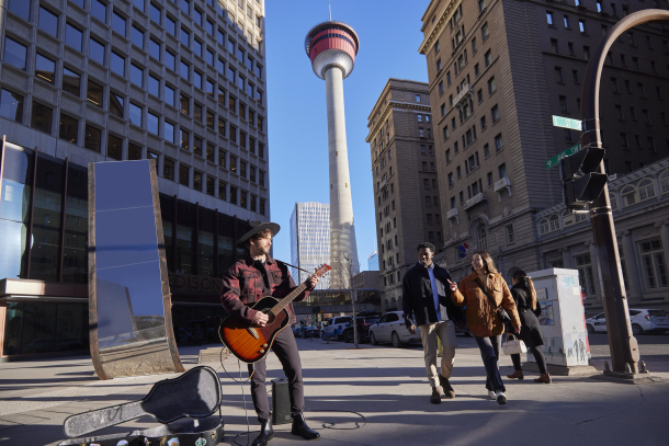 Busker playing guitar downtown calgary