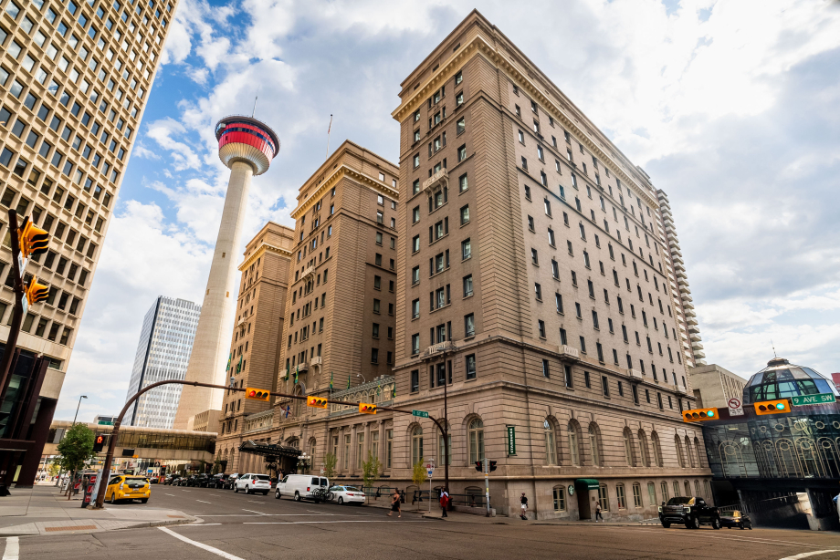 Exterior of the Fairmont Palliser Hotel beside the Calgary Tower
