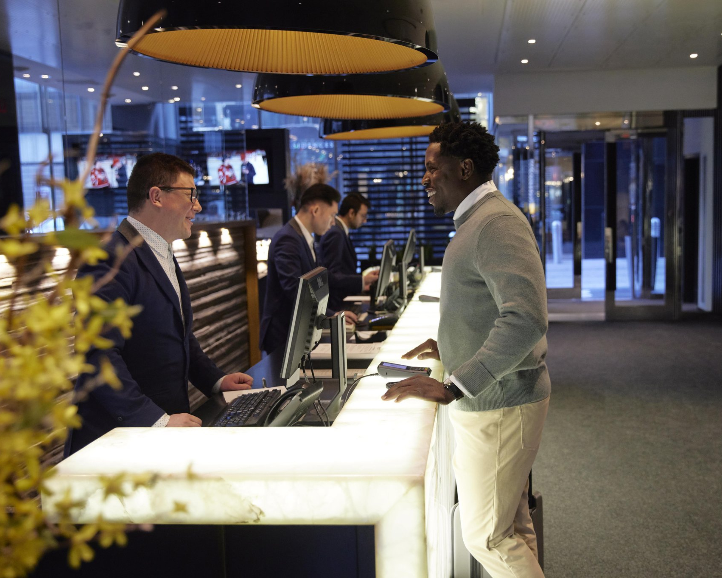 a man checking in to Hotel Le Germain in downtown Calgary
