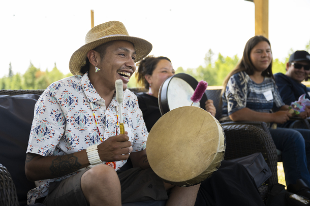 Indigenous man drumming