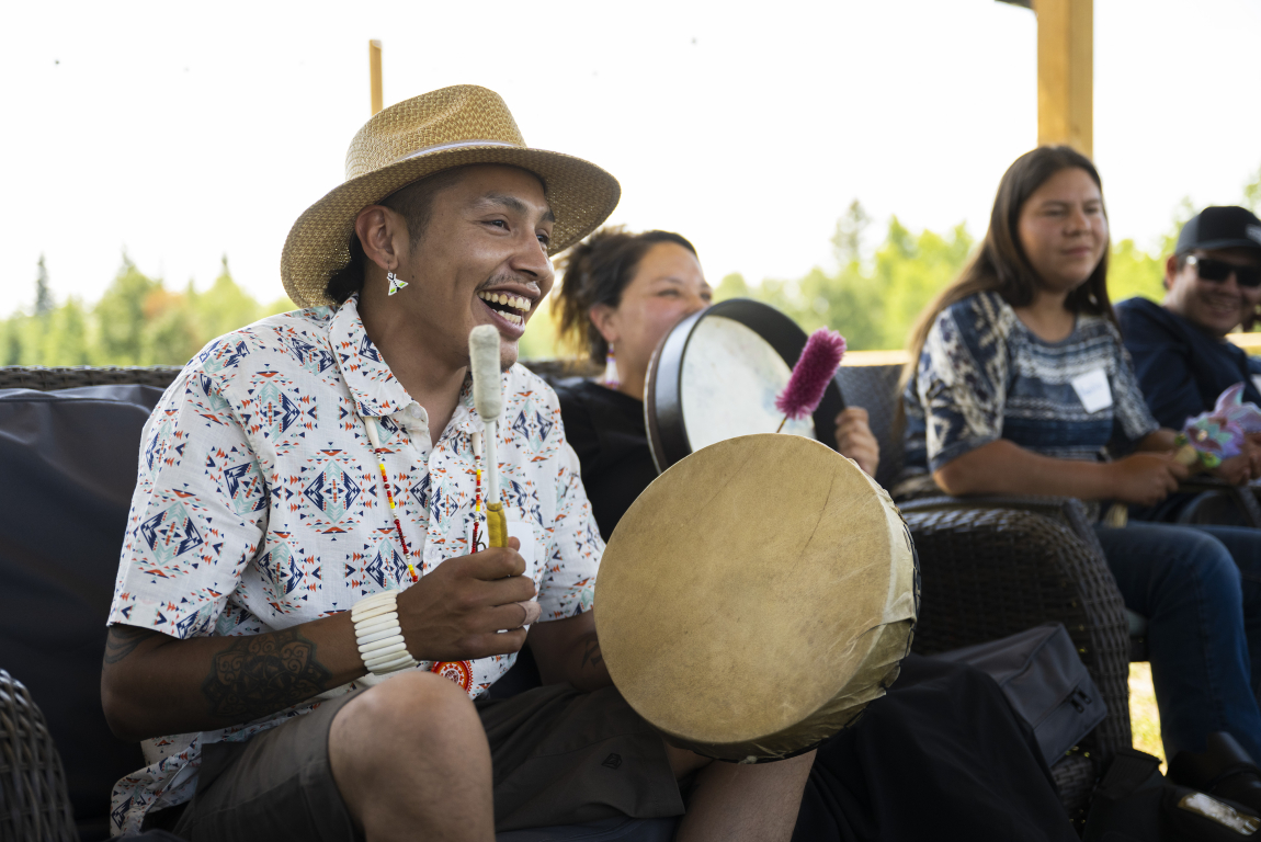 Indigenous man drumming