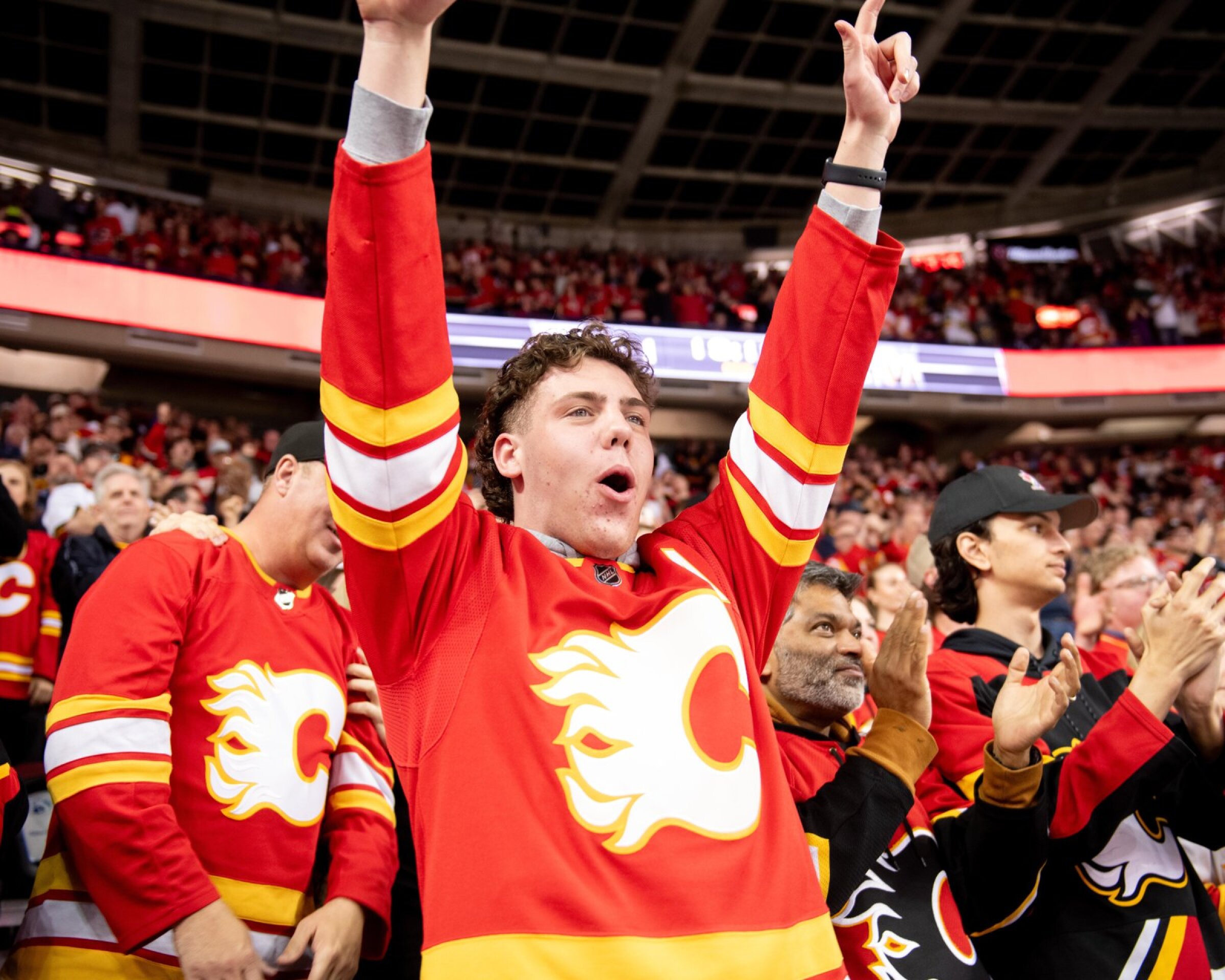 A crowd cheers on the Calgary Flames at the Scotiabank Saddledome.