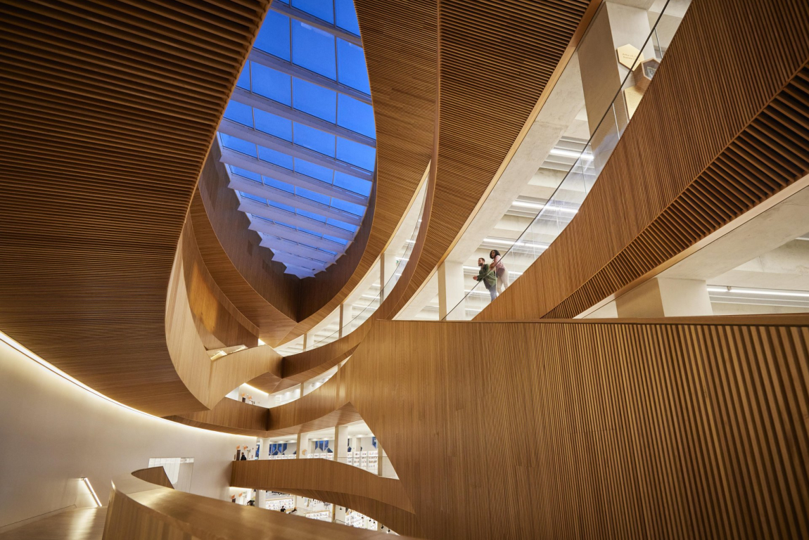 Couple admiring the modern architecture inside Calgary’s Central Library.