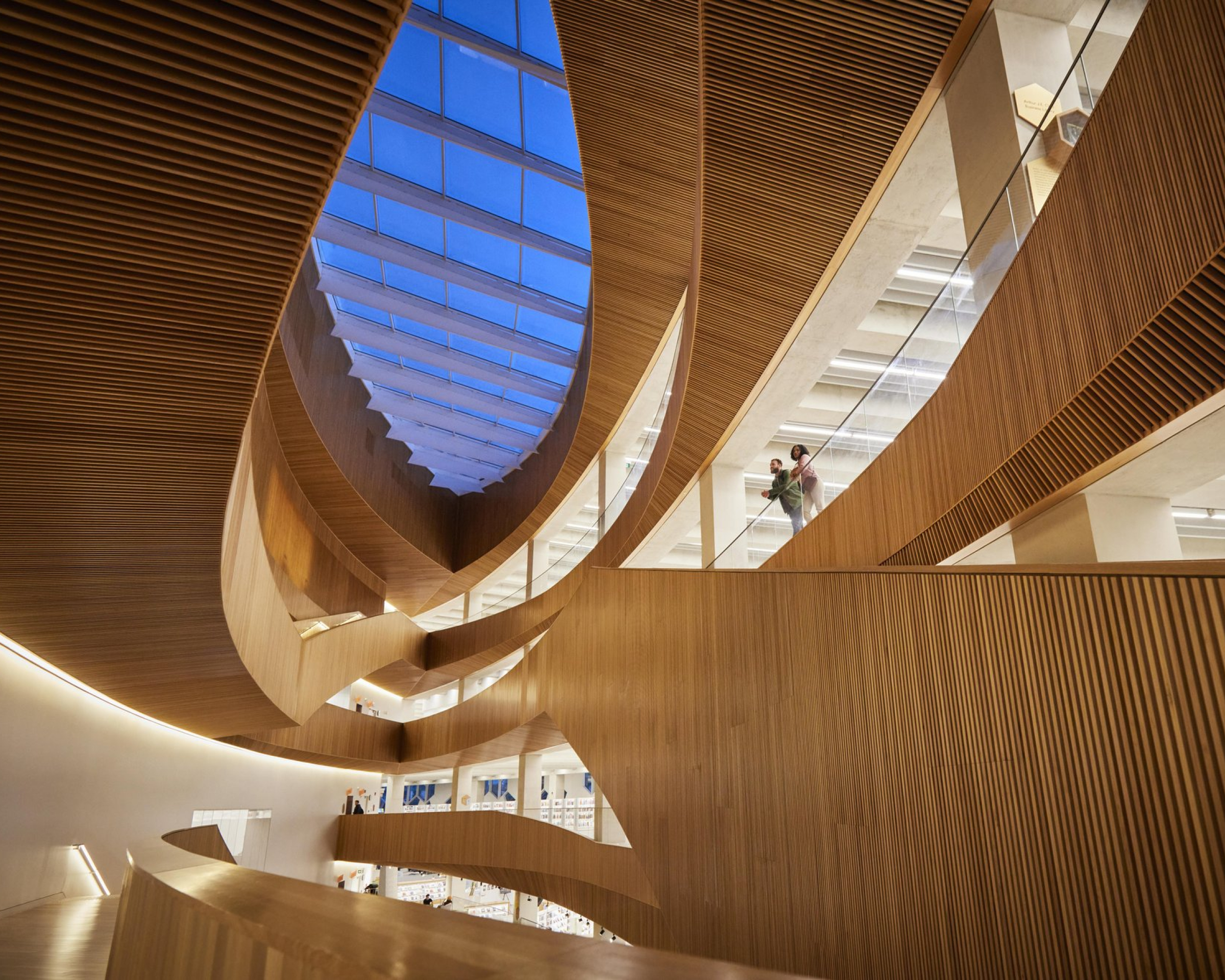 Couple admiring the modern architecture inside Calgary’s Central Library.