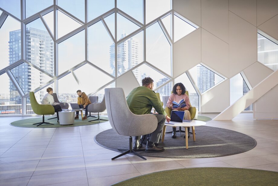 People sitting indoors and reading at the Calgary Central Library