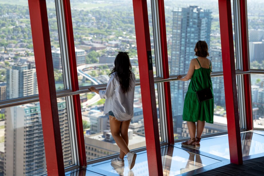 2 females exploring the Calgary Tower Observation Deck Summer 2025