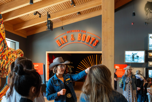 A tour guide shows guests around the Sam Centre.