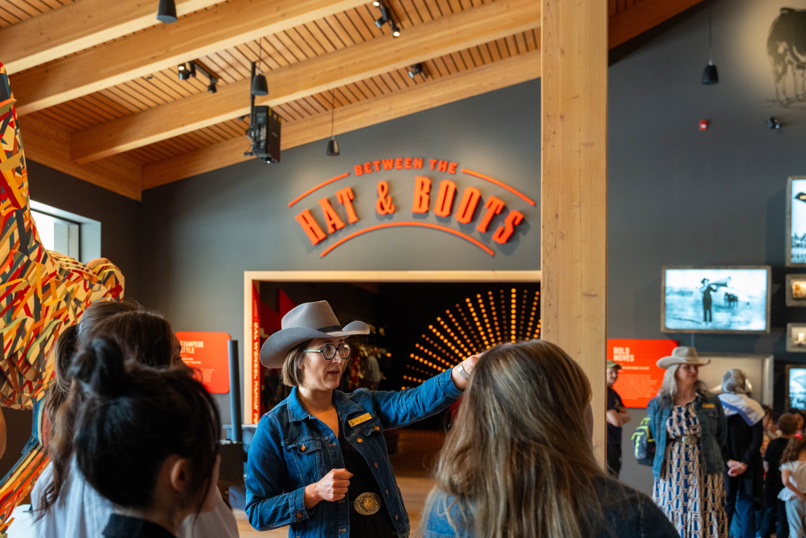 A tour guide shows guests around the Sam Centre.
