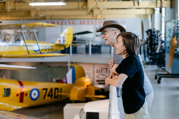 grandpa and grandaughter exploring the Hangar flight mus