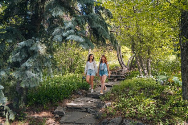 Two women walking down a stone pathway at Reader Rock Garden.